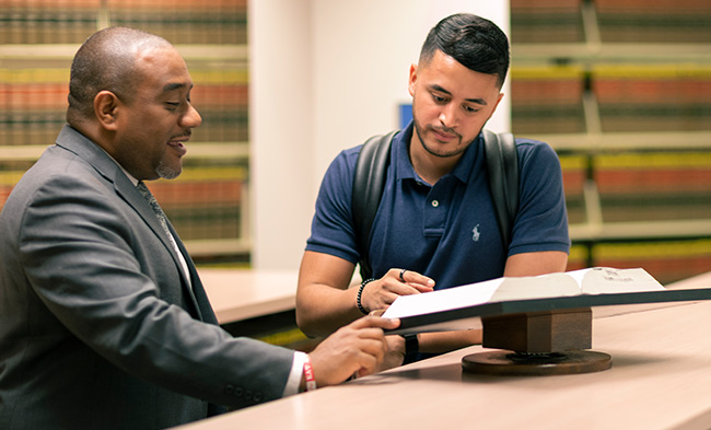 Two men in law library